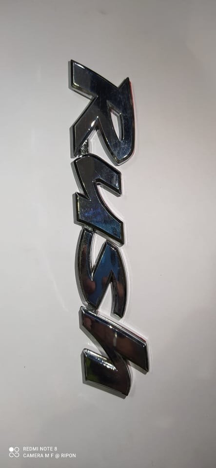 Car Monogram RUSH Silver in color