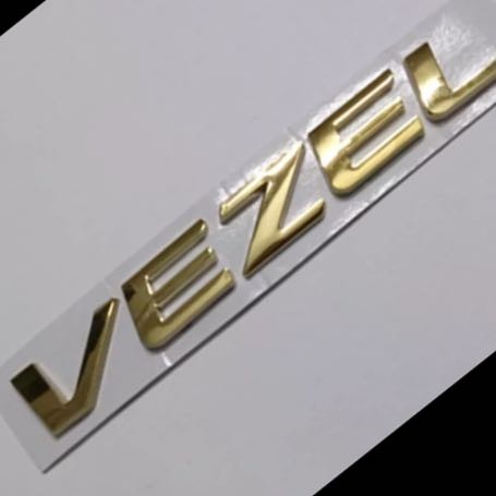 Car Monogram Logo VEZEL Golden in Color